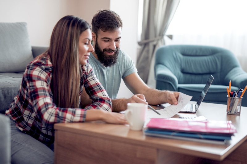 A couple budgeting together to manage their credit card debt.